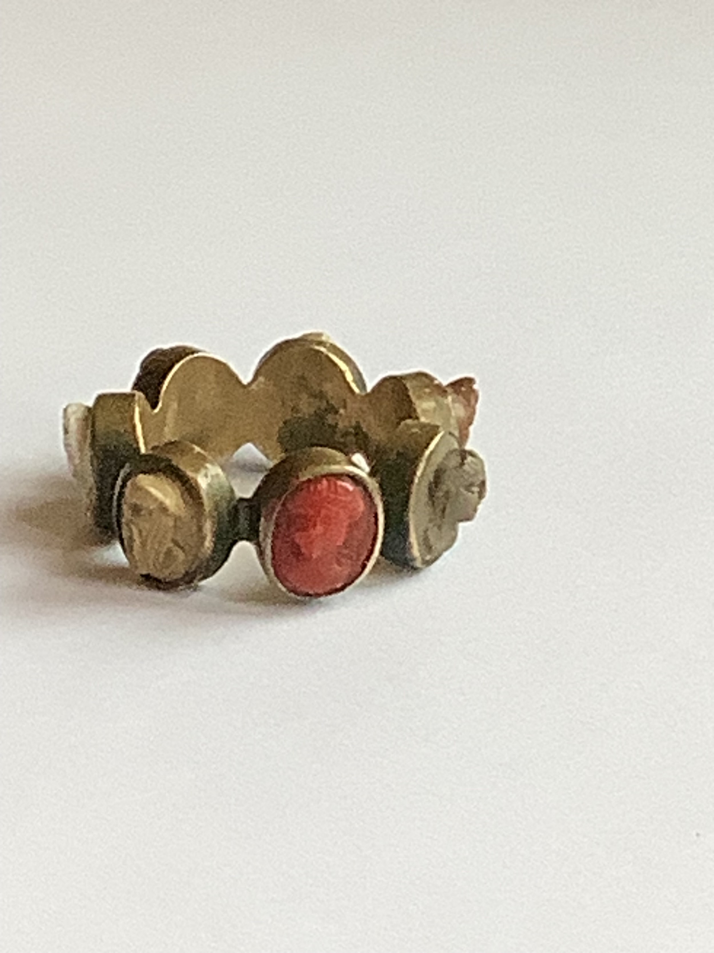 A rare and unusual grand tour cameo ring with seven cameos. Ring size M