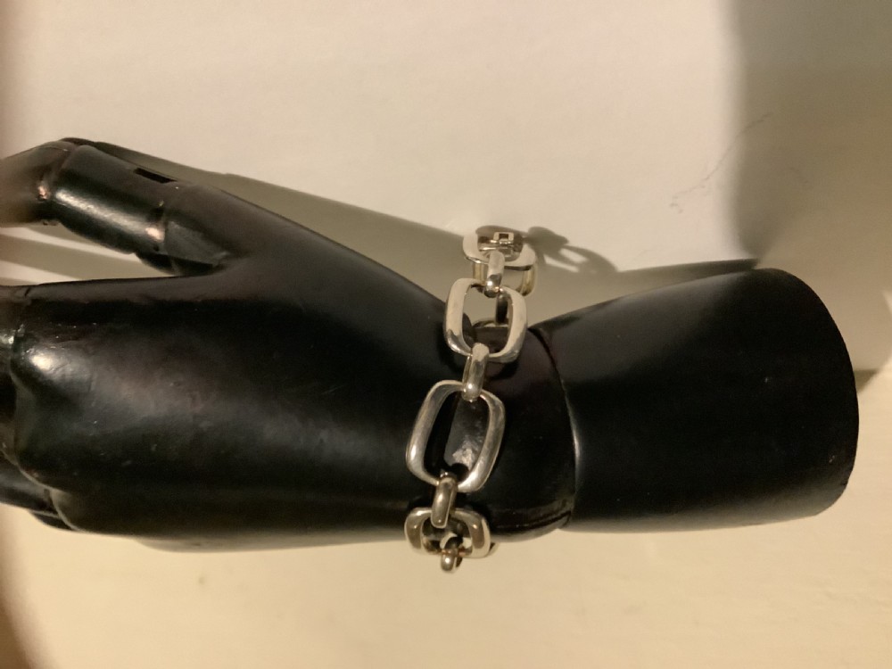 An Art Deco silver chain link bracelet featuring elongated openwork rectangular links. View II
