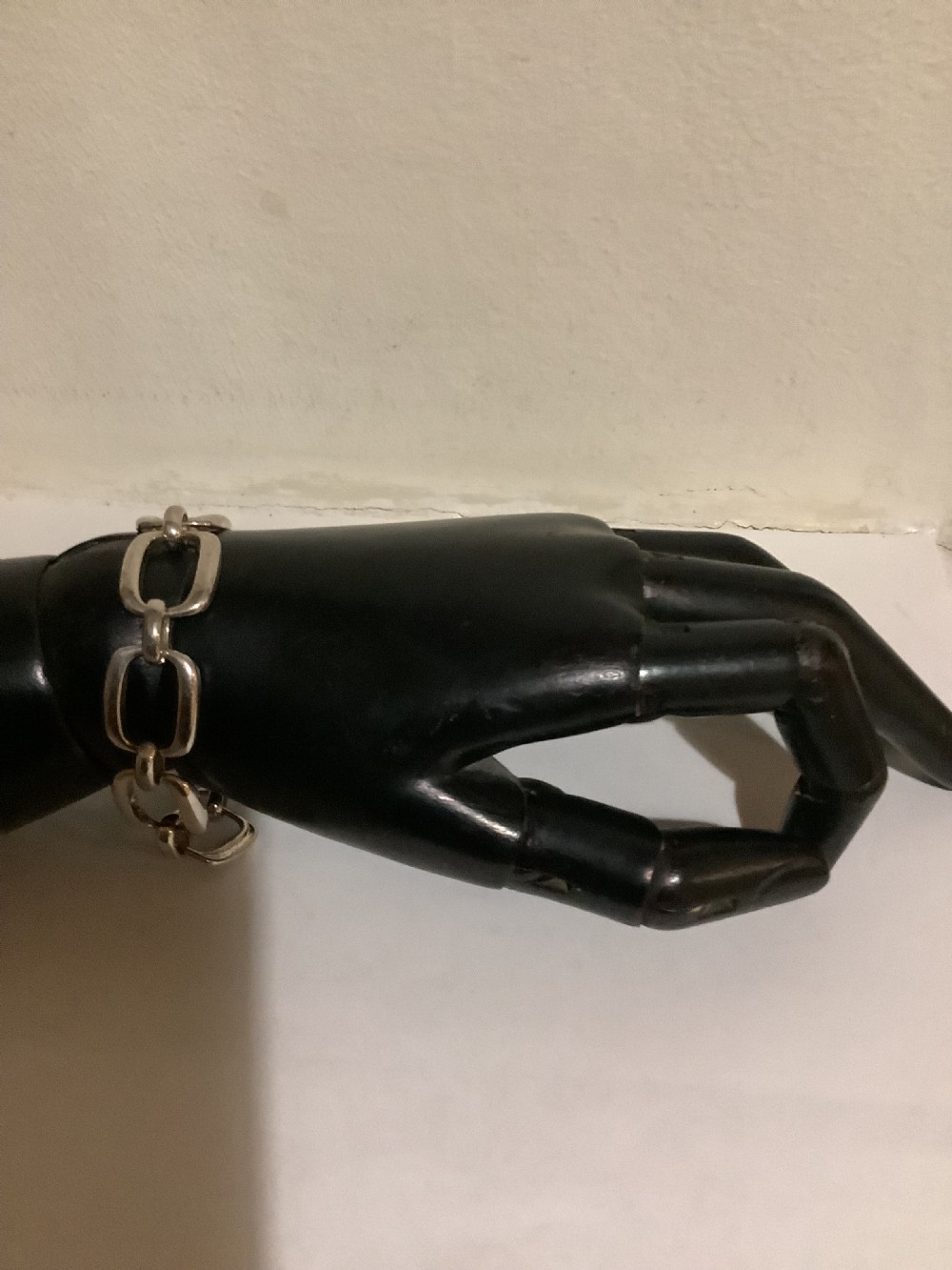 An Art Deco silver chain link bracelet featuring elongated openwork rectangular links. View III