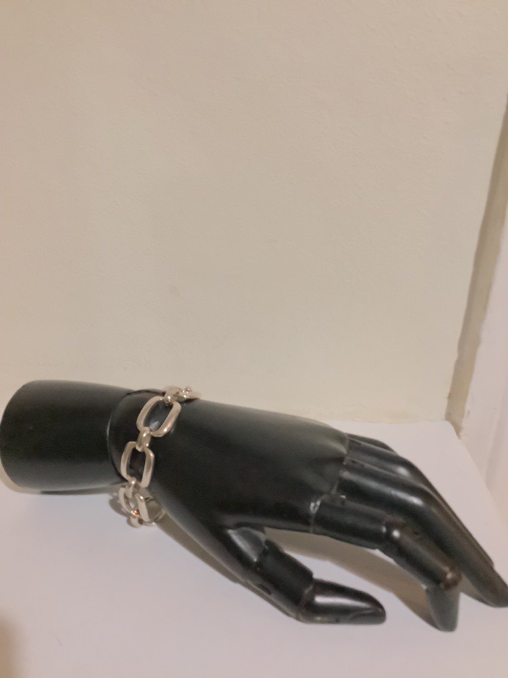An Art Deco silver chain link bracelet featuring elongated openwork rectangular links. View IV