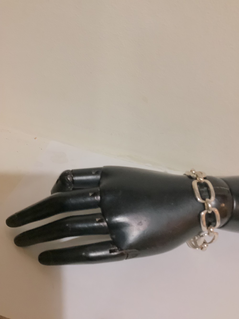An Art Deco silver chain link bracelet featuring elongated openwork rectangular links. View VII