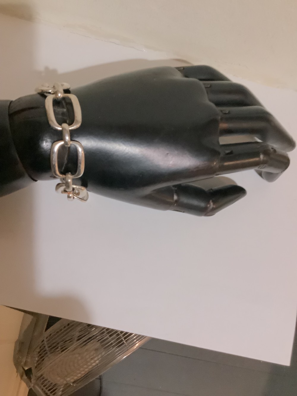 An Art Deco silver chain link bracelet featuring elongated openwork rectangular links. View IX