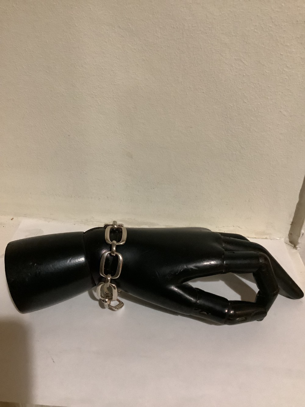 An Art Deco silver chain link bracelet featuring elongated openwork rectangular links. View X