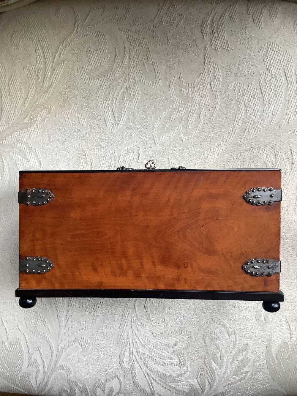 A French satinwood rectangular letter box featuring twin letter slots, cut steel studding forming French script lettering, a decorated steel handle, and corner mounts. View VI