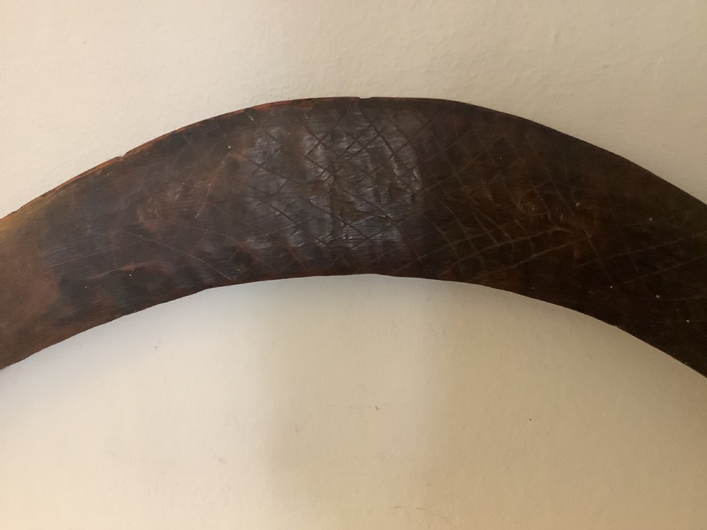 A fine antique hand carved Aboriginal boomerang deep dark rich patina. View V