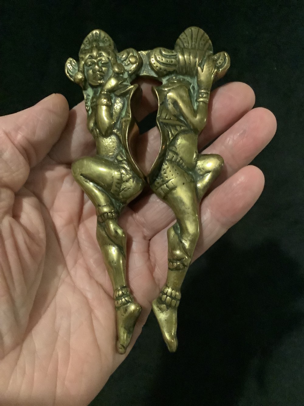 A cast brass novelty nutcracker fashioned in the form of two articulated dancing female figures. View VII