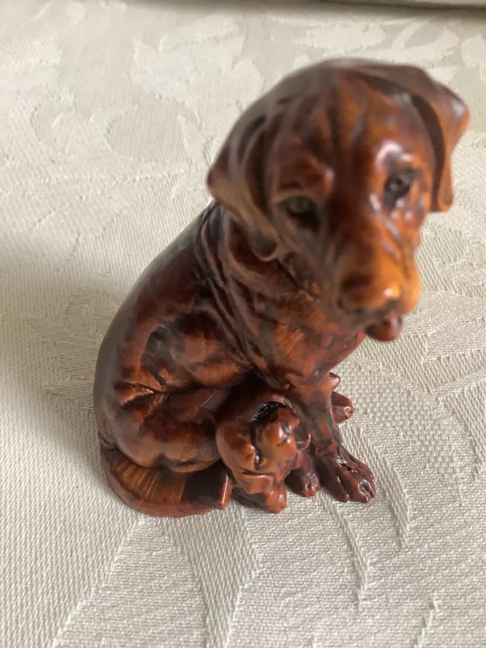 A very finely carved small hardwood figure of dog and pup View V