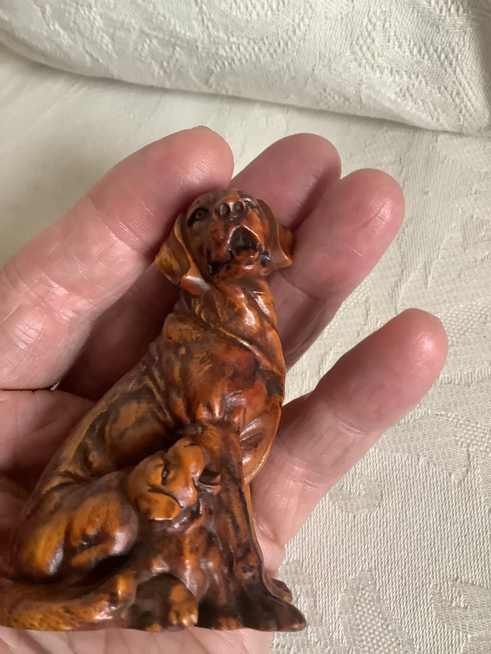A very finely carved small hardwood figure of dog and pup View VII