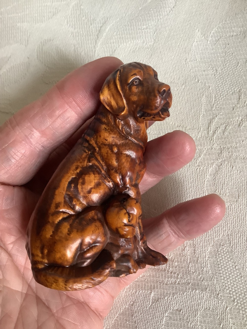 A very finely carved small hardwood figure of dog and pup View VIII