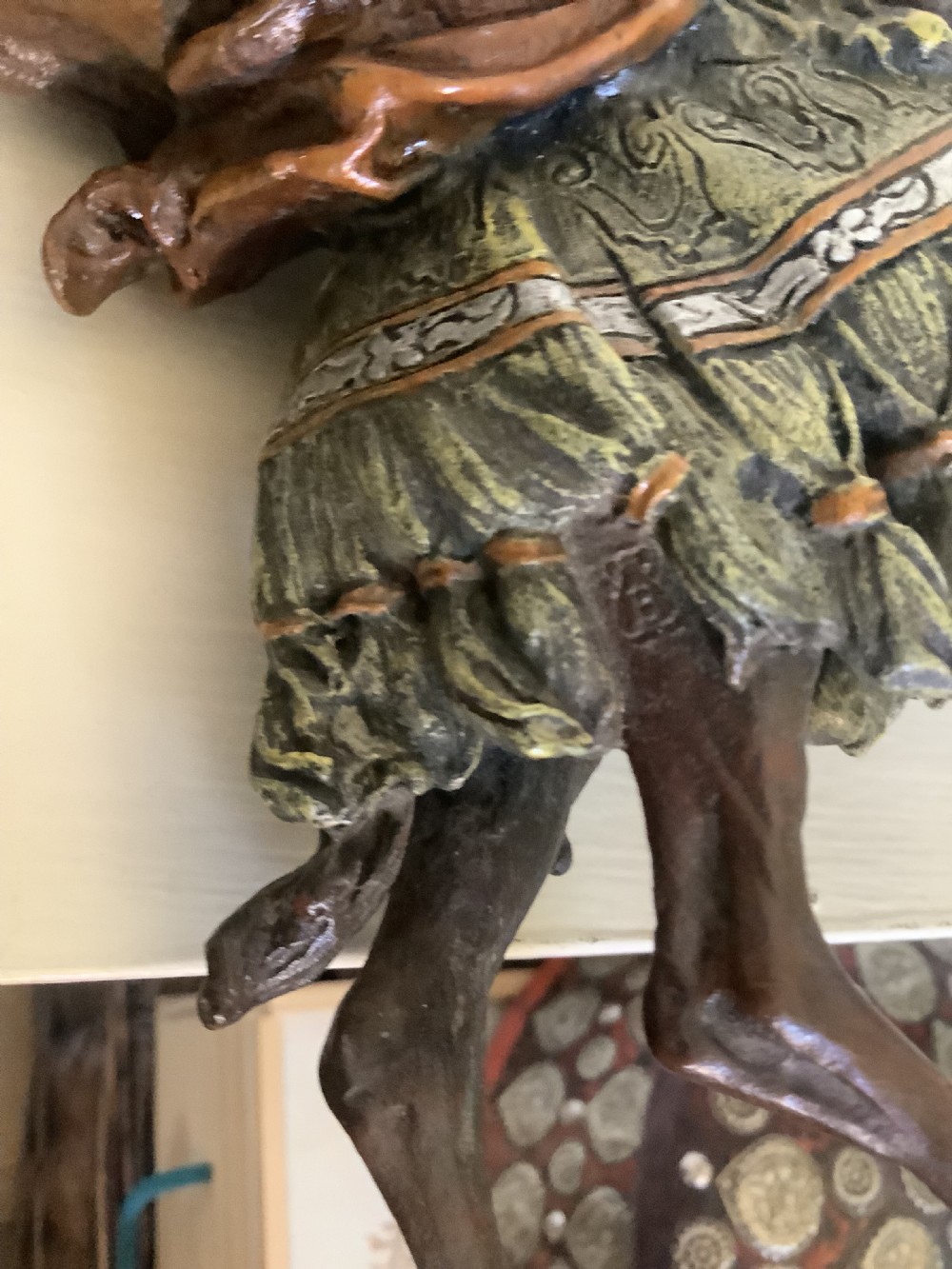 A cold painted bronze sculpture depicting a draped Arabic rider holding a rifle atop a camel. View VII