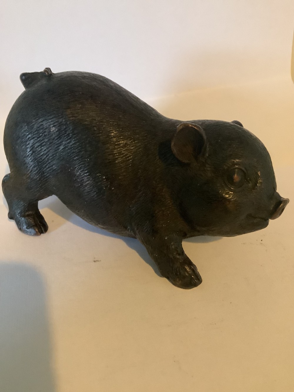 A charming 19th century Chinese bronze figure of a pig