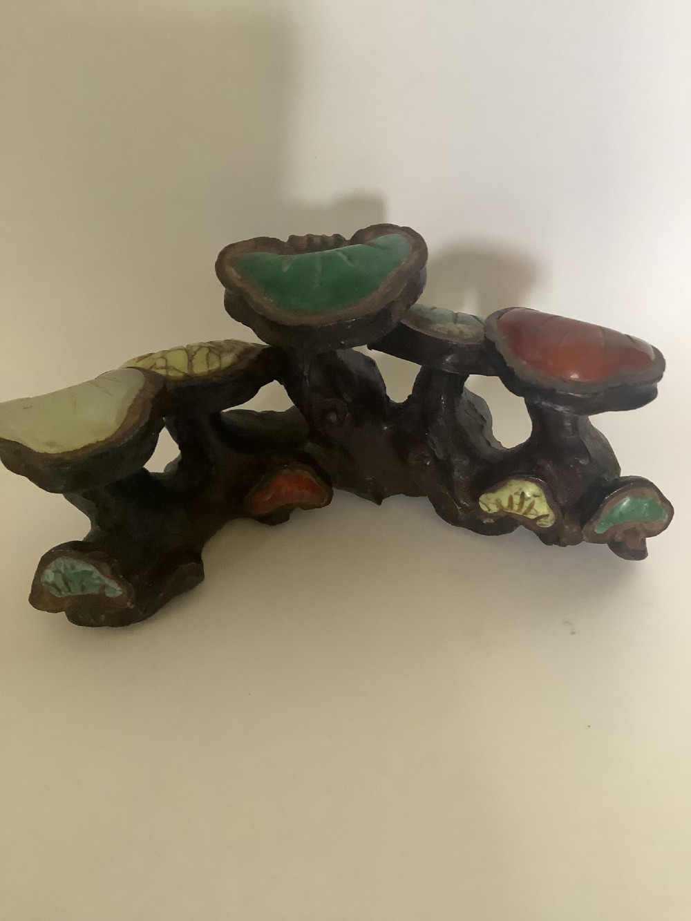 A 19th-century cast bronze Chinese scholars brush rest modelled in the form of lingzhi mushrooms with colourful inset hardstone caps. View II