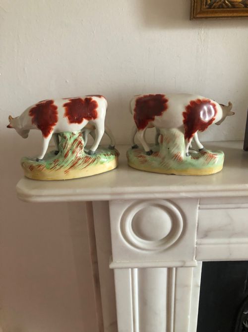 A CHARMING PAIR OF NINETEENTH CENTURY STAFFORDSHIRE COWS WITH CALVES - ADDITIONAL PHOTO 1