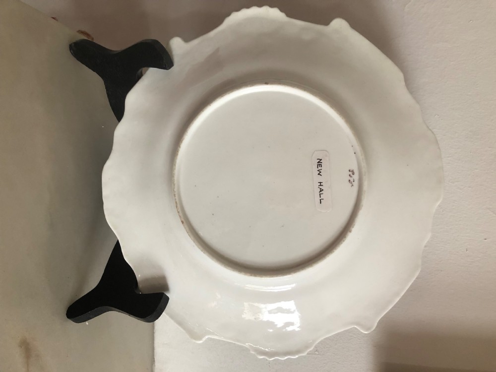 An early nineteenth-century New Hall porcelain cabinet plate featuring a cobalt blue and gold scrollwork border around a central hand-painted floral reserve. View II