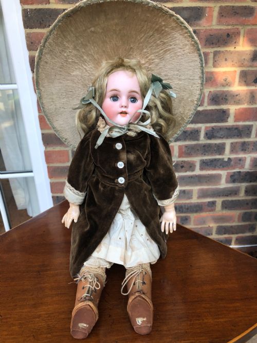 A Charming German Bisque Headed Doll in Original Clothes C.1910