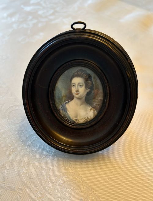 BRITISH SCHOOL MID 18TH CENTURY OVAL PORTRAIT MINIATURE OF A LADY IN AN EBONISED FRAME