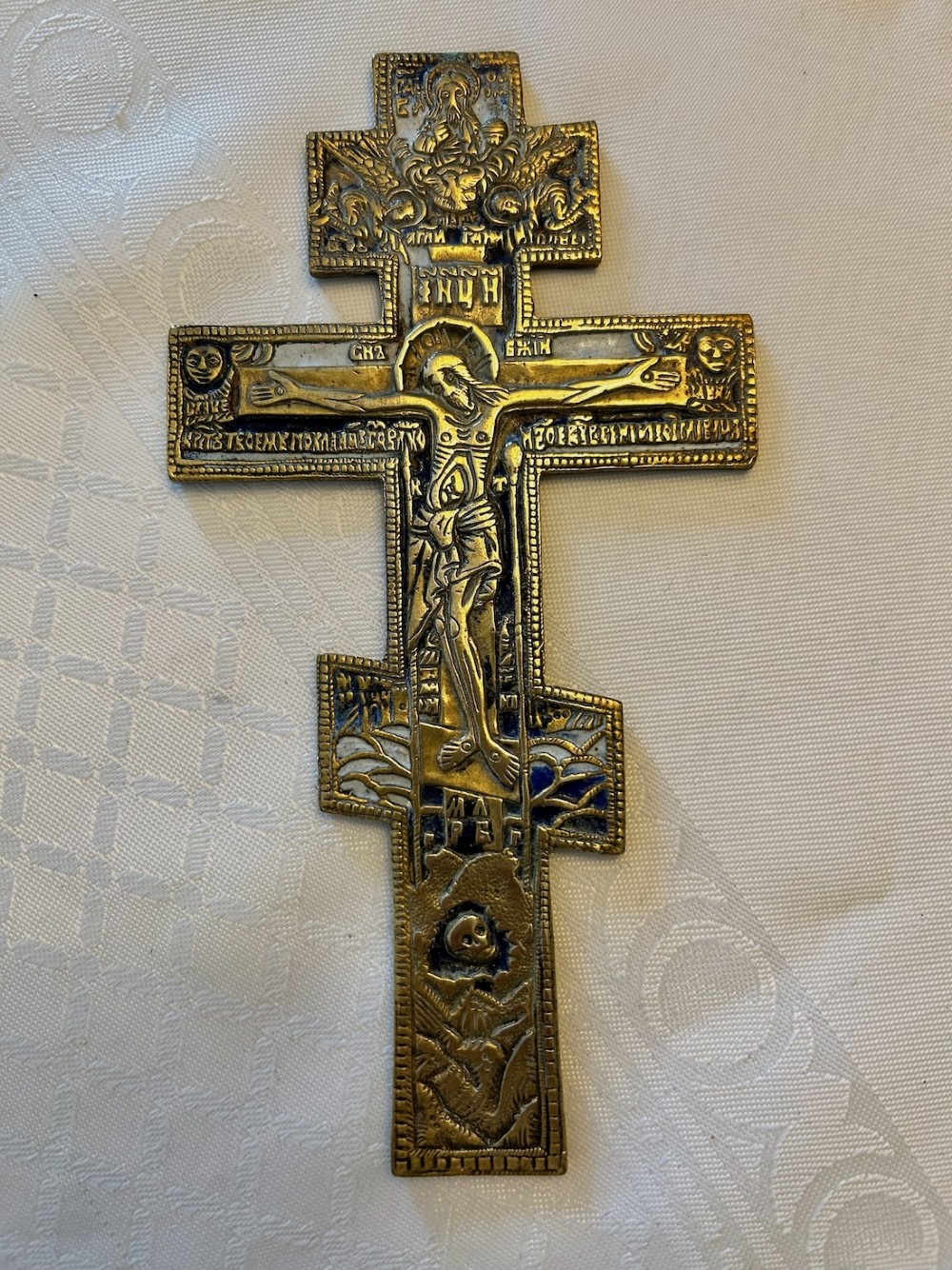 A 19th-century cast bronze Russian Orthodox eight-pointed cross featuring inlaid blue and white enamel detailing and Cyrillic inscriptions. View II
