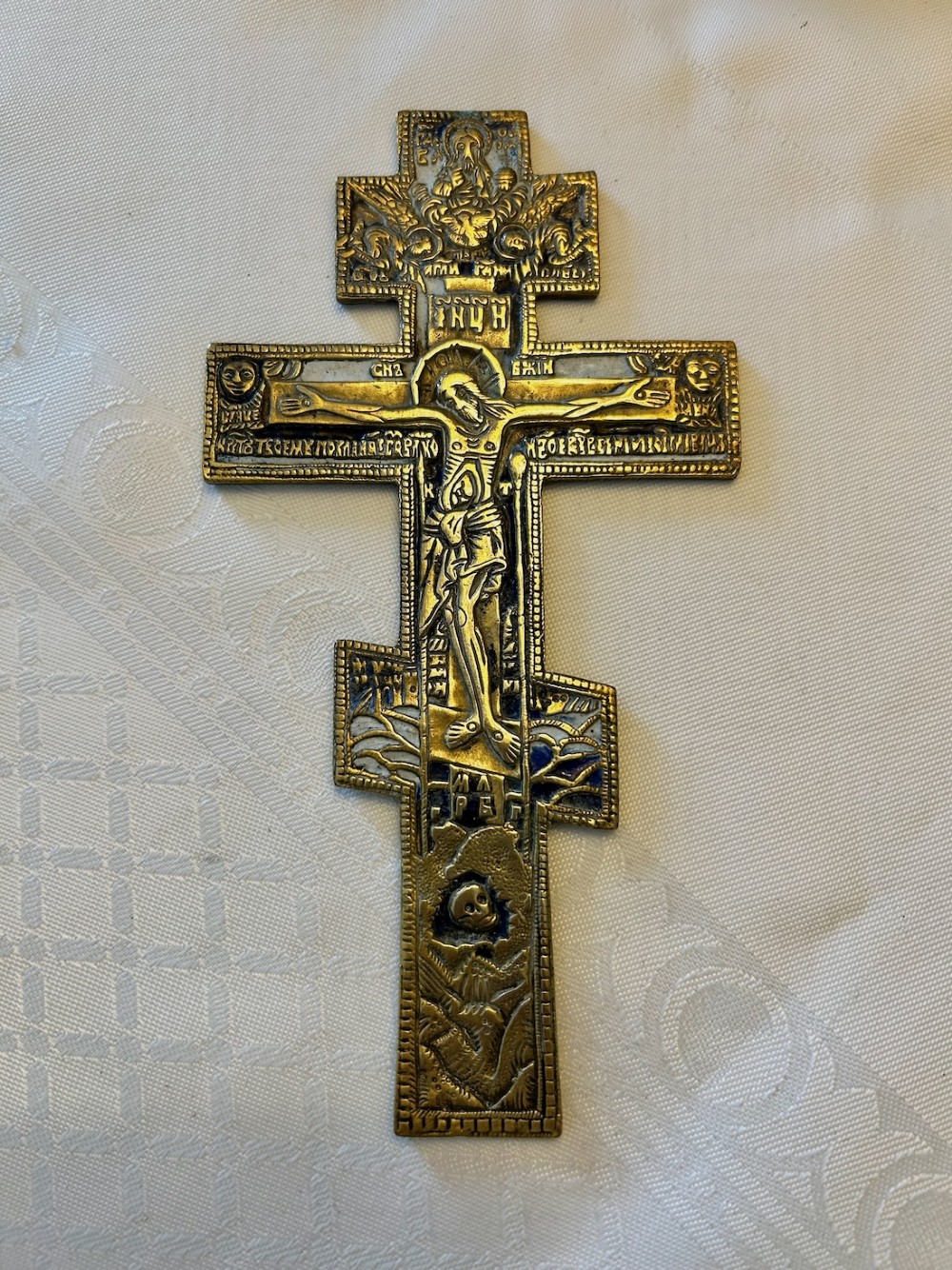 A 19th-century cast bronze Russian Orthodox eight-pointed cross featuring inlaid blue and white enamel detailing and Cyrillic inscriptions. View IV