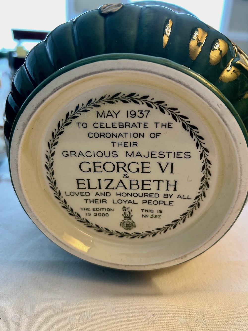 A brown glazed earthenware twin-handled loving cup featuring relief-moulded profile portraits of King George VI and Queen Elizabeth dated 1937. View VIII