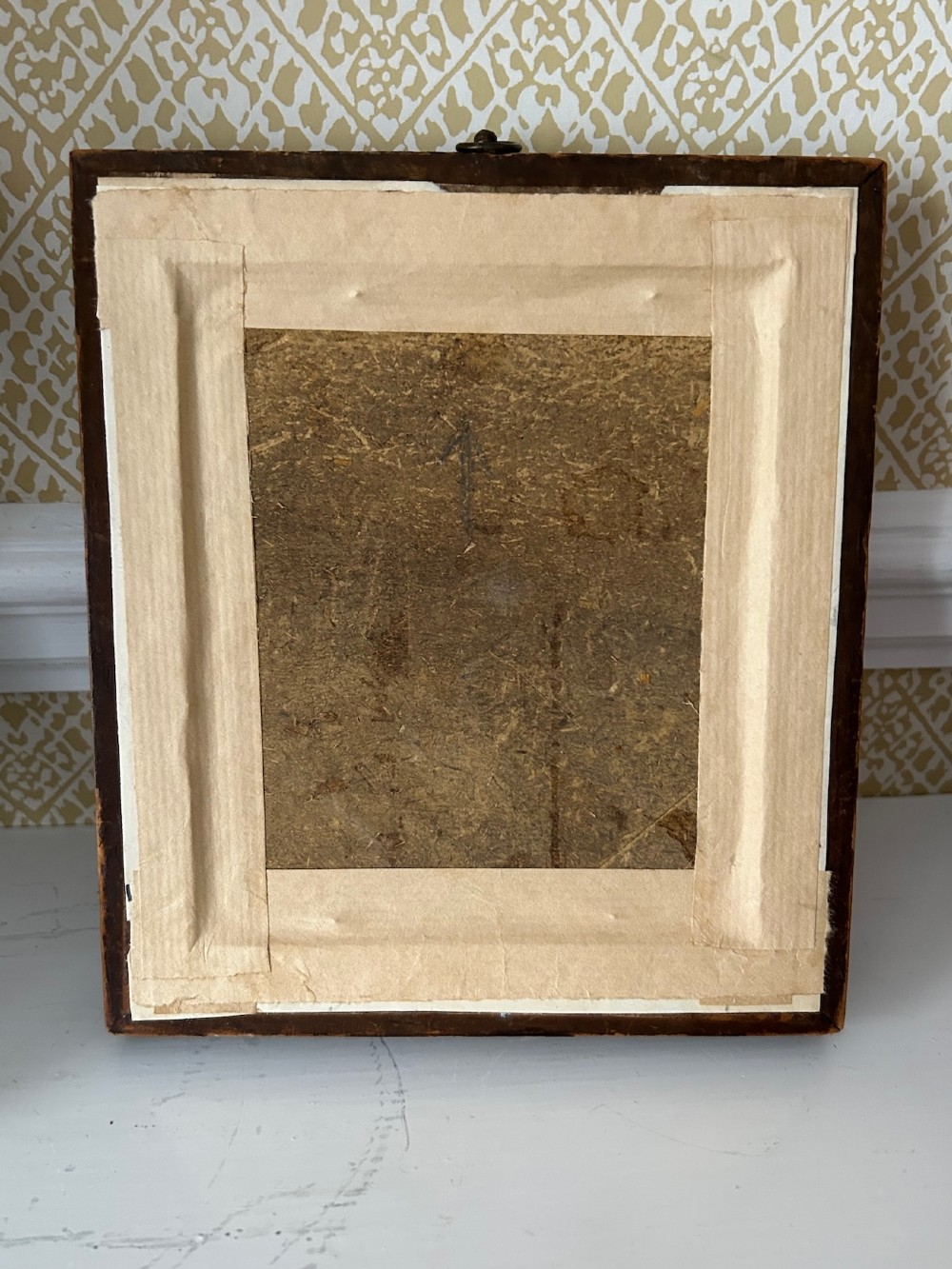 A Victorian watercolour portrait depicting a young boy holding a book seated outdoors, displayed inside a wide birdseye maple wooden frame. View IV
