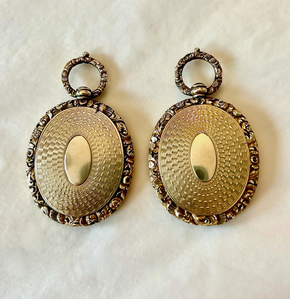 A Pair of Late 18th Century Portrait Miniatures of a Husband and Wife in Gilt Oval Frames View V