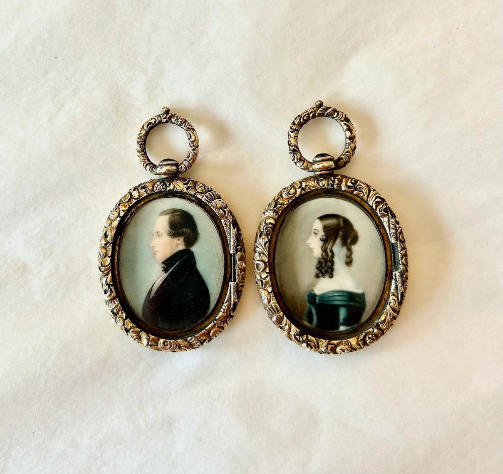 A Pair of Late 18th Century Portrait Miniatures of a Husband and Wife in Gilt Oval Frames View VI