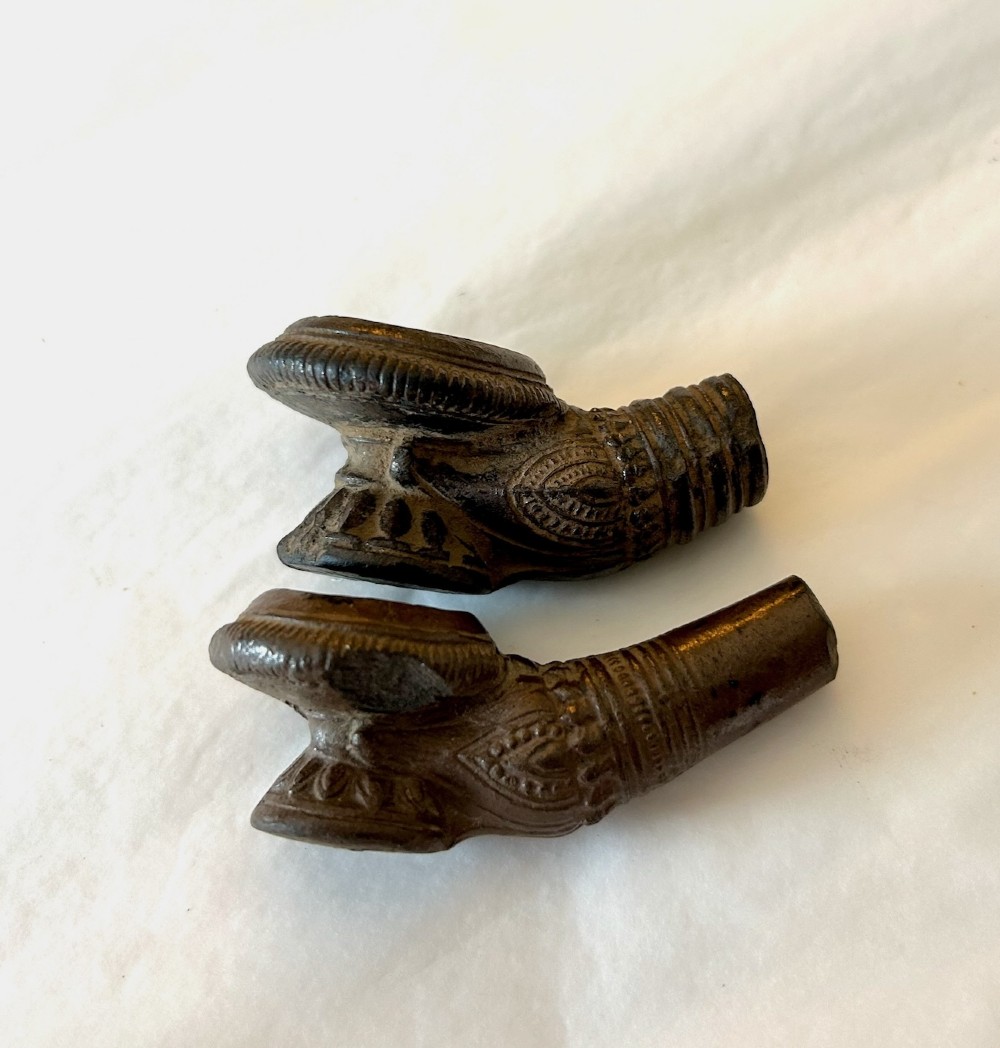 A pair of Chinese Sancai lead-glazed earthenware altar offerings depicting a boars head and a fish on circular dish bases. View VII
