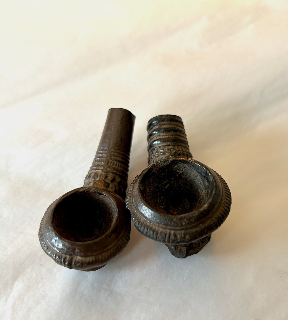A pair of Chinese Sancai lead-glazed earthenware altar offerings depicting a boars head and a fish on circular dish bases. View VIII