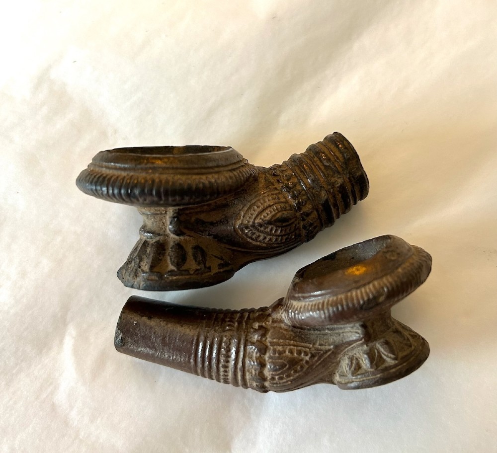 A pair of Chinese Sancai lead-glazed earthenware altar offerings depicting a boars head and a fish on circular dish bases. View X