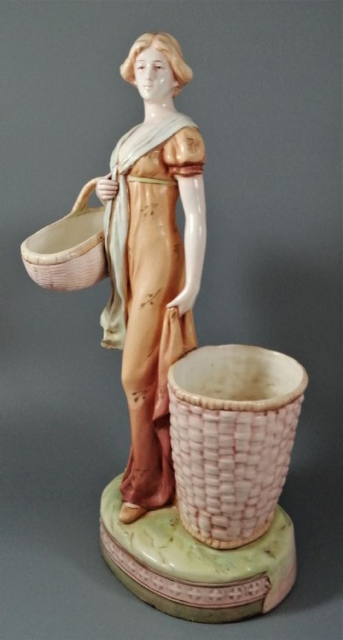 fig 1. Antique Royal Dux figurine of a woman with wicker baskets