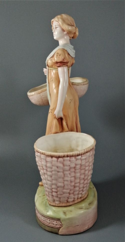fig 2. Antique Royal Dux figurine of a woman with wicker baskets