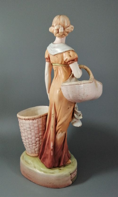 fig 5. Antique Royal Dux figurine of a woman with wicker baskets