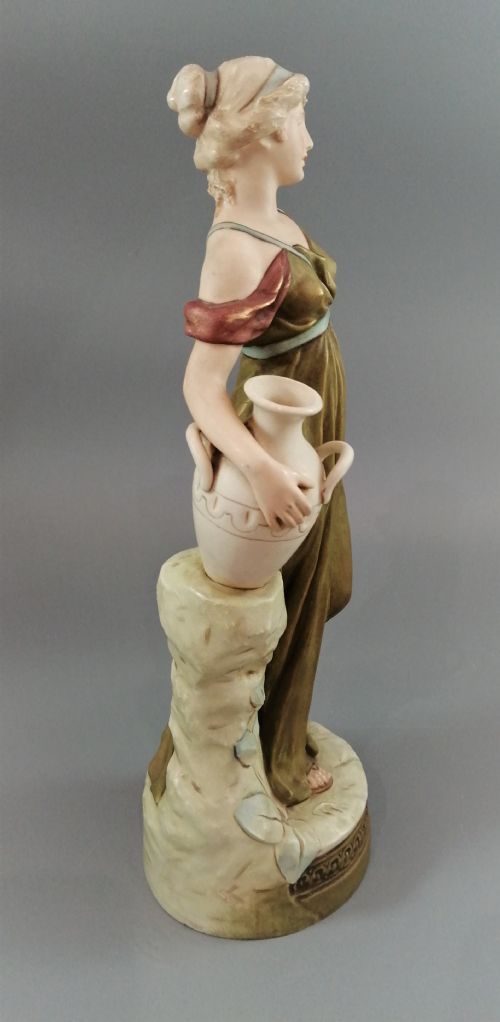 fig 3. Beautiful antique Royal Dux porcelain figurine depicting a lady holding a jug.