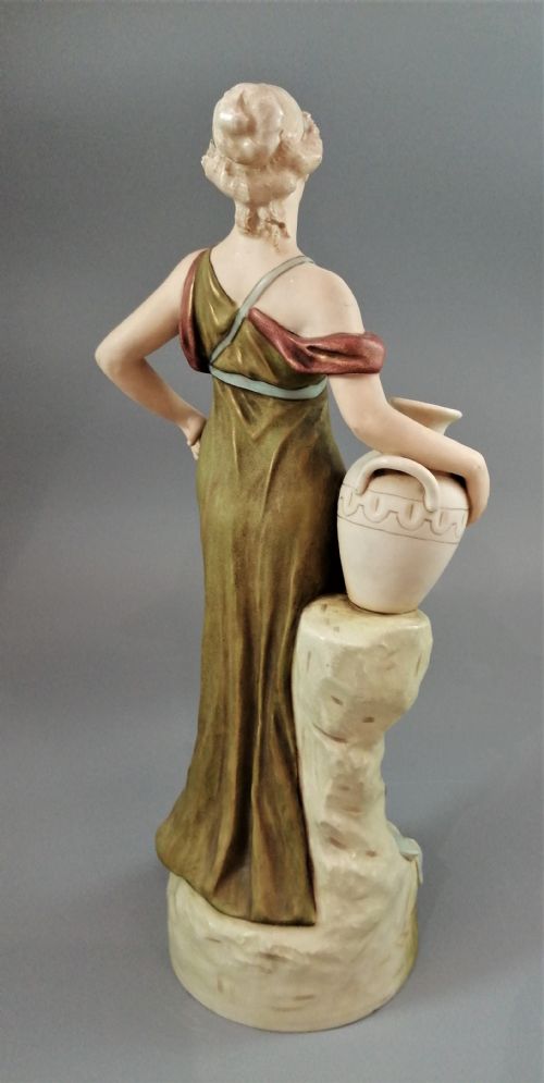 fig 4. Beautiful antique Royal Dux porcelain figurine depicting a lady holding a jug.