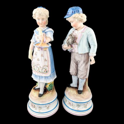fig 1. Pair of large antique 19th century French bisque porcelain figurines