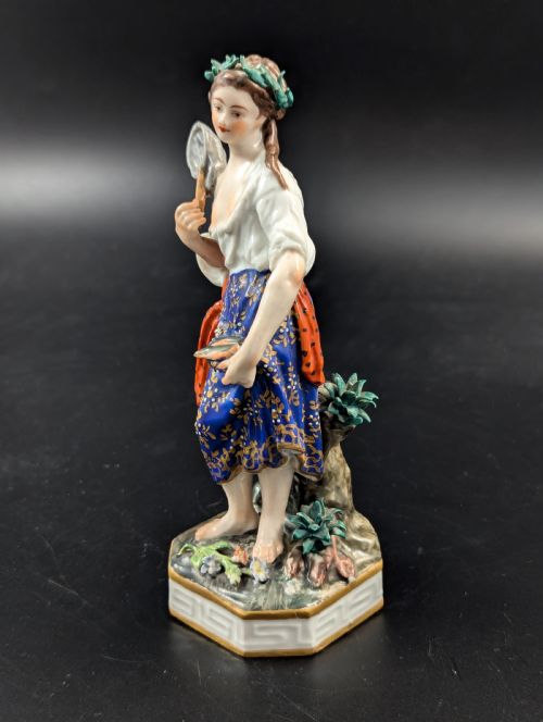 fig 1. An antique hand-painted Derby porcelain figurine depicting an allegory of water on a moulded base.