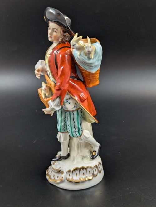 fig 1. Lovely early 20th century Sitzendorf porcelain figurine of a young rabbit seller.