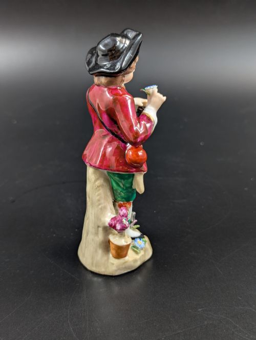 fig 3. Lovely early 20th century Sitzendorf porcelain figurine of a young gardener.