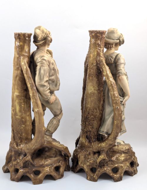 fig 3. A pair of nineteenth-century Bohemian porcelain figurines depicting a man and woman in folk attire framed by gilded root-like arbours on sculpted bases.