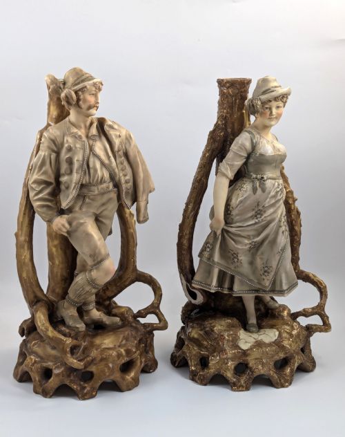 fig 4. A pair of nineteenth-century Bohemian porcelain figurines depicting a man and woman in folk attire framed by gilded root-like arbours on sculpted bases.