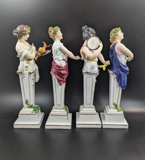 fig 4. A set of four 19th-century glazed Italian porcelain figurines depicting allegorical female figures representing the arts atop gilded square pedestals.