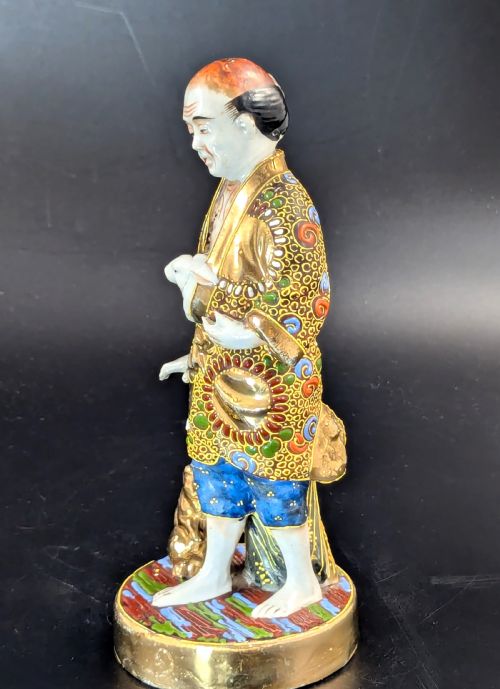 fig 2. Antique Japanese Satsuma Porcelain Figurine Man with Rabbits, Meiji period (1868 -1912).