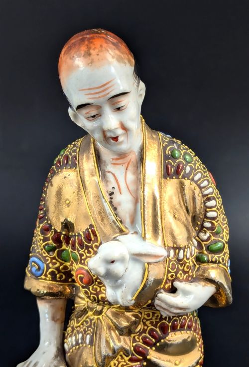 fig 5. Antique Japanese Satsuma Porcelain Figurine Man with Rabbits, Meiji period (1868 -1912).