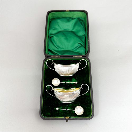 fig 2. Pair of antique gilt sterling silver boxed navette salts with shell spoons, 1900