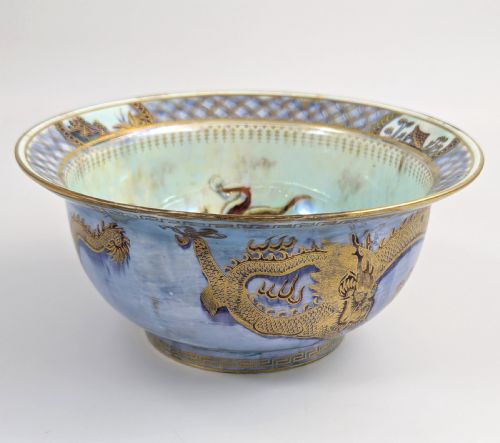 fig 2. An antique light blue lustre porcelain bowl decorated with a detailed gilded dragon motif around the exterior.