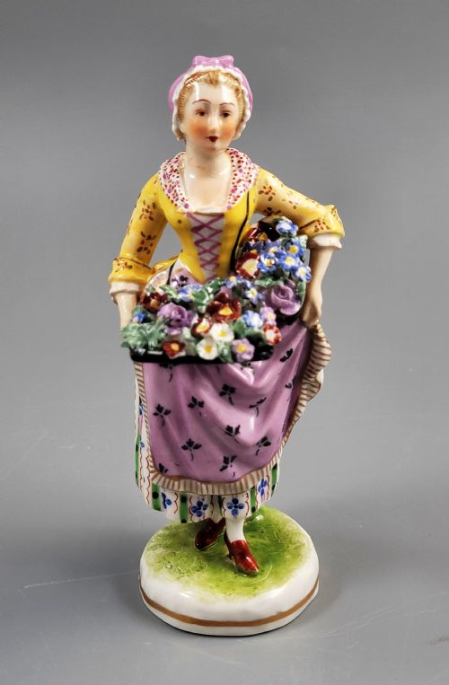 RARE PORCELAIN FIGURINE OF A FLOWER SELLER ATTRIBUTED TO DRESSEL KISTER CIE PASSAU C1903