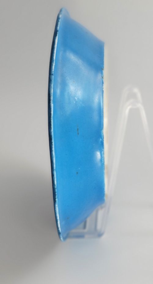 fig 1. An oval French porcelain tray featuring a bleu celeste ground with hand-painted floral reserves and a central scene depicting figures in a landscape enclosed by gilt ornamentation.