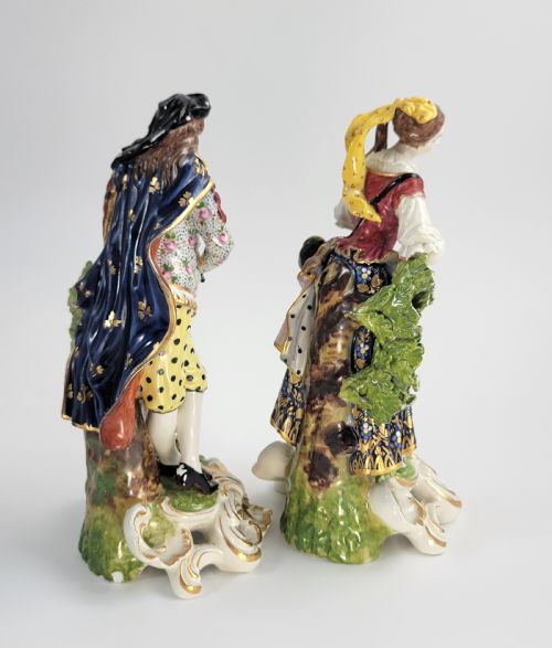 fig 3. A pair of 19th-century French Samson porcelain figures depicting a male musician with a pipe and drum alongside a female musician holding a triangle, set on gilded rococo scrollwork bases.