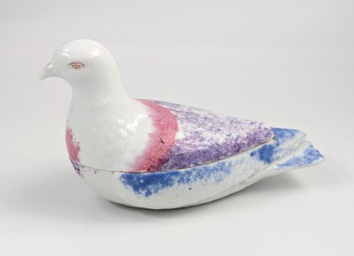 fig 1. A late nineteenth-century Imperial Russian porcelain butter dish shaped as a seated bird with pink, purple, and blue stippled decoration.