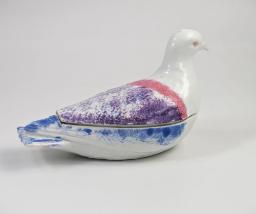 fig 3. A late nineteenth-century Imperial Russian porcelain butter dish shaped as a seated bird with pink, purple, and blue stippled decoration.